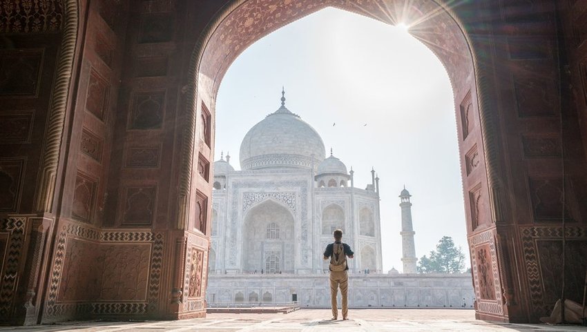 Man looking at the Taj Mahal in India
