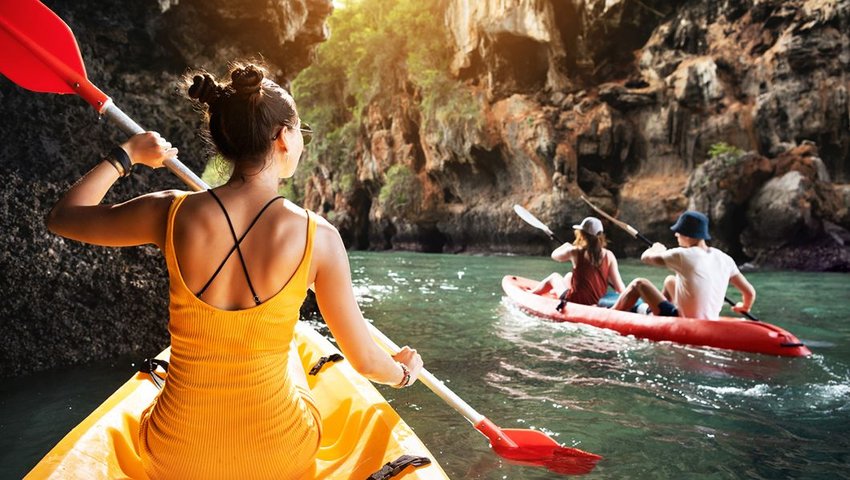 People kayaking in ravine