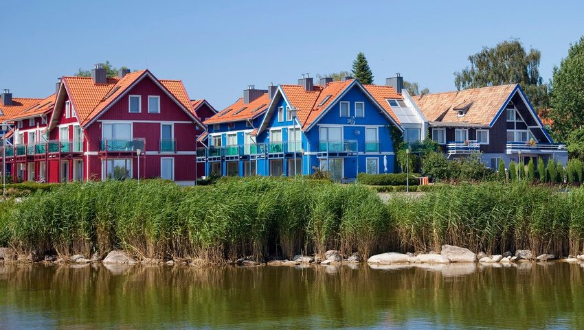 Brightly colored homes in Nida, a small fishing village near the Curonian Spit, Lithuania