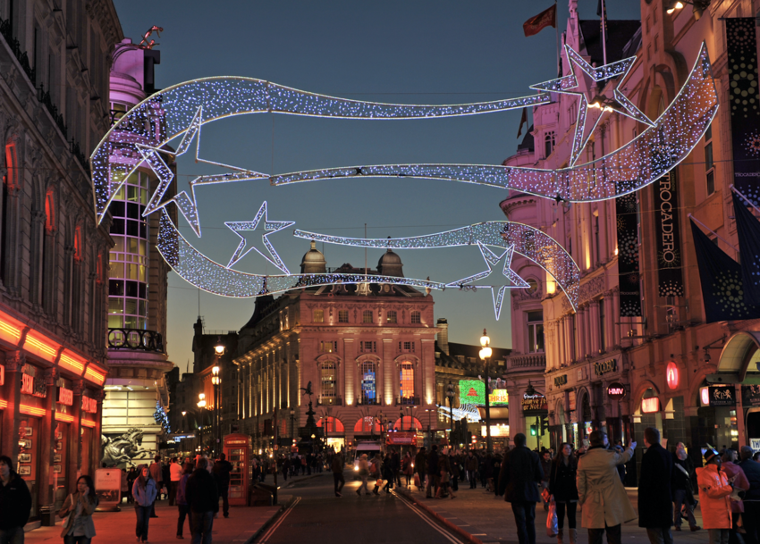 London at night with Christmas lights hung in the street