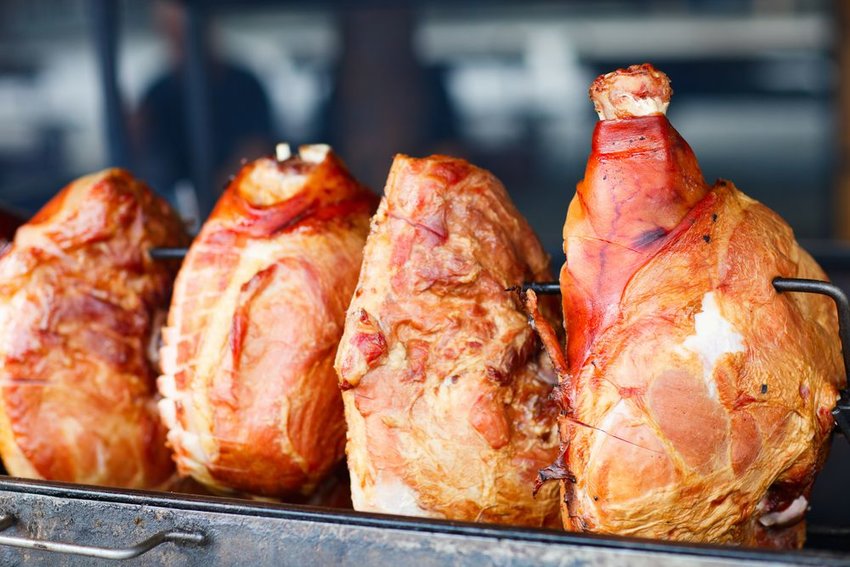 Row of ham being cooked in Prague