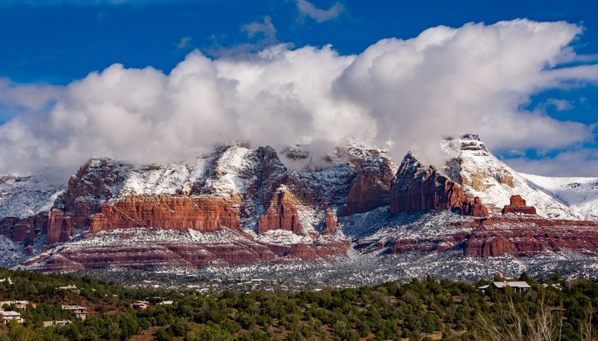 Mountains covered in snow with clouds in Sedona, Arizona