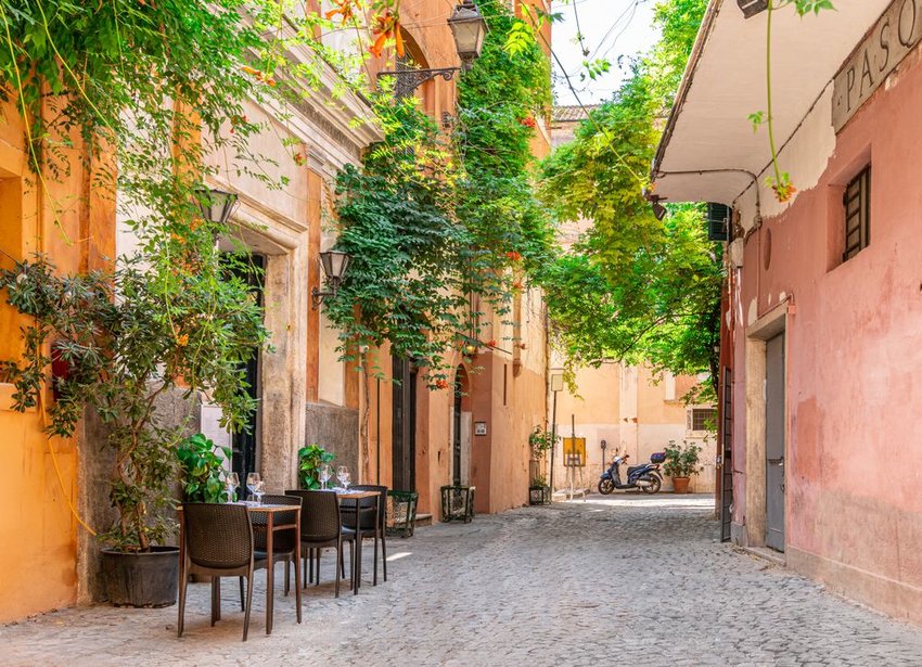 Cozy street with plants in Trastevere, Rome, Europe