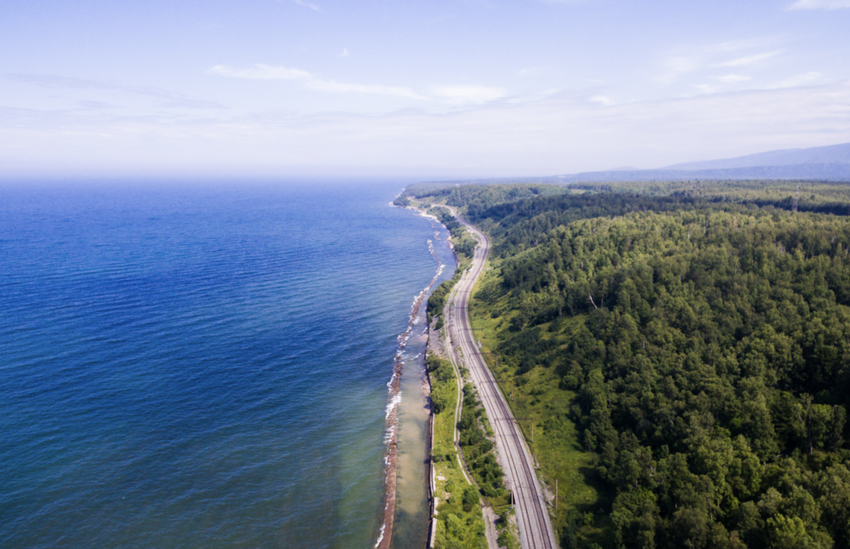 Trans-Siberian Railway on the Baikal lake shore from aerial view