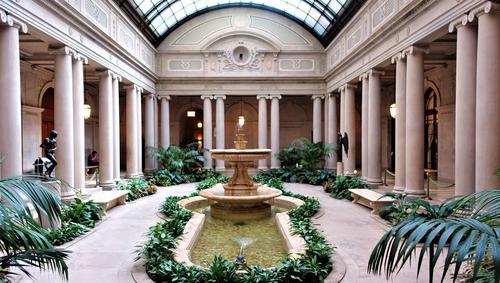 The Frick Collection with open roof and fountain in the middle 