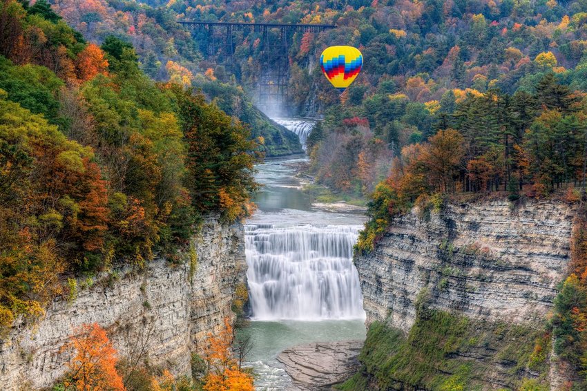 Hot air balloon over waterfalls at Letchworth State Park in New York