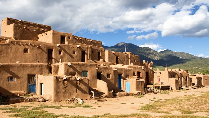 Taos Pueblo with mountains in the background