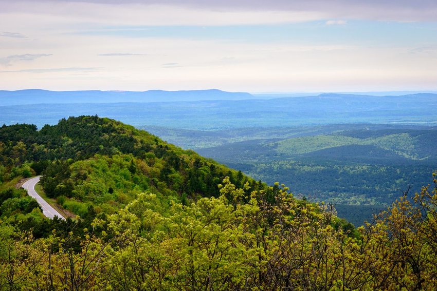 Talimena National Scenic Byway through forest with hills in distance