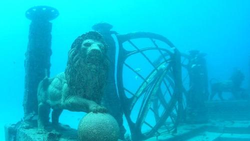 Stone lion and gate underwater