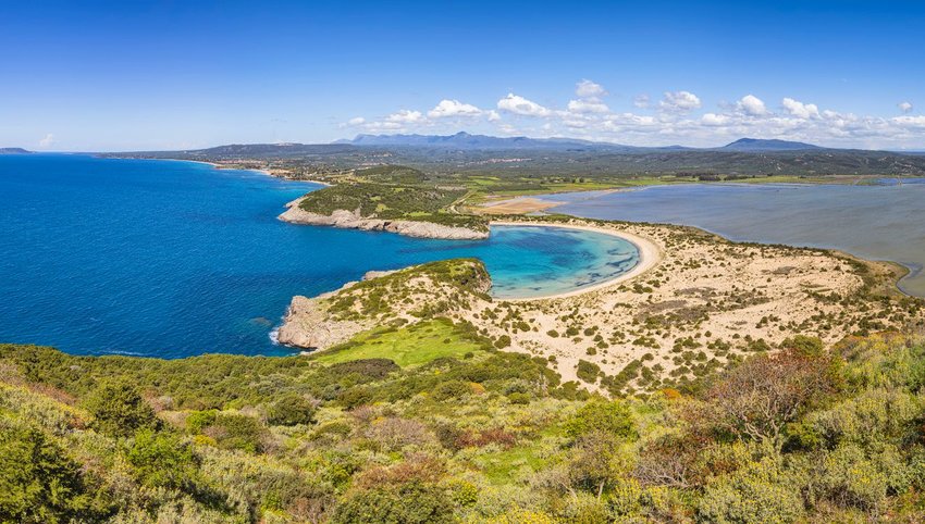 Aerial view of beach that is shaped like the Greek letter omega (Ω)