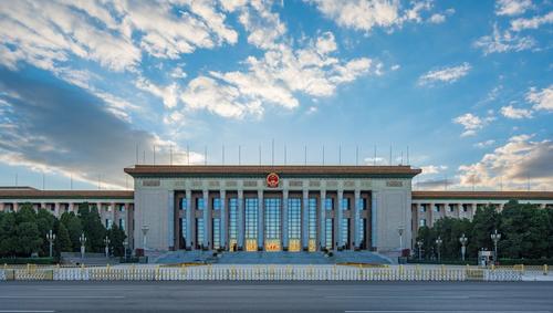 View of front exterior of Great Hall of the People on a cloudy day 