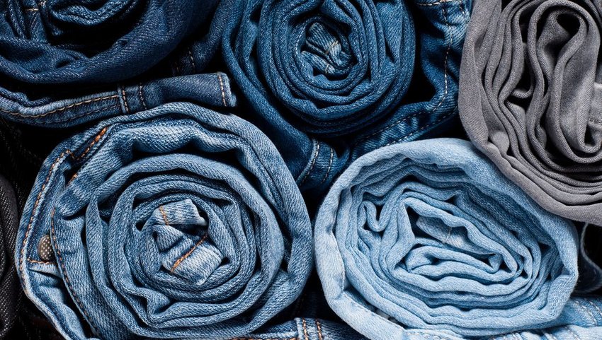 Rows of jeans rolled up 