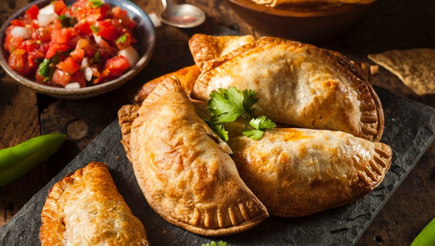 Empanadas on a plate with pico de gallo