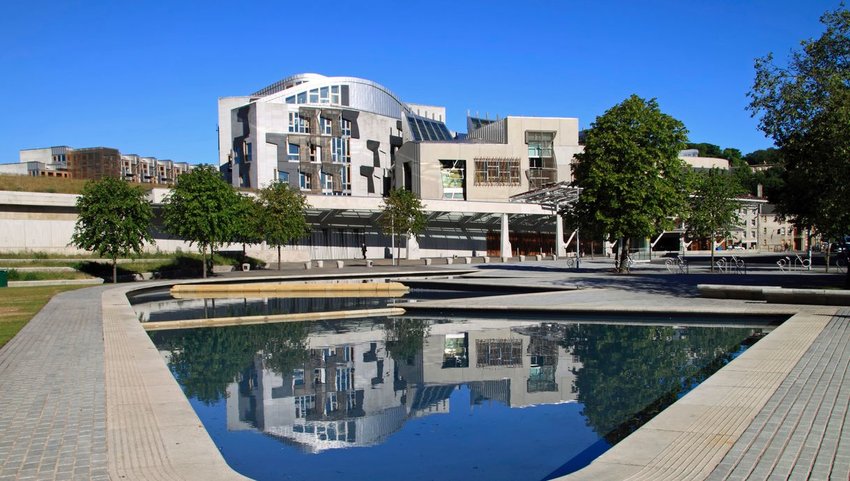 Exterior view of Scottish Parliament Building with man made pond in front