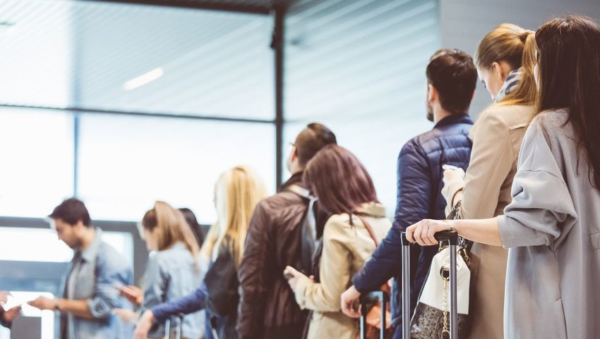 Group of people waiting in line at the airport