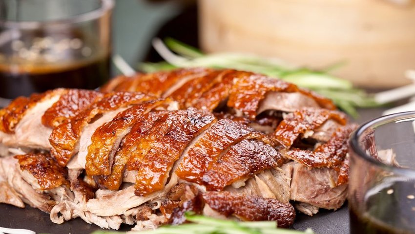Cooked peking duck with drinks