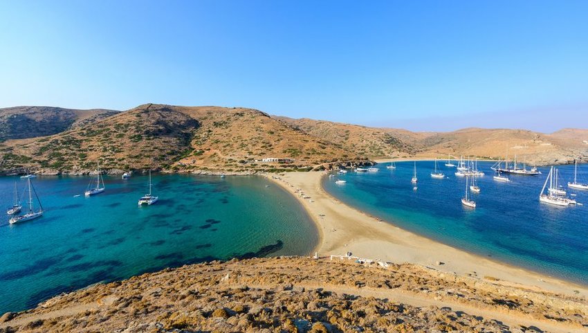 Kolona double sided beach with group of boats on each side 