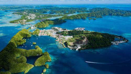 Aerial view of Koror and surrounding islands in bright blue water