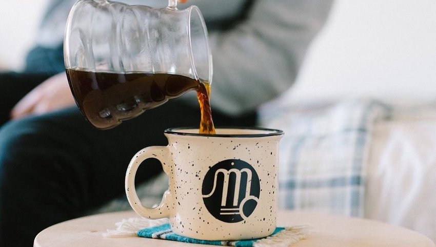 Coffee pouring into a mug