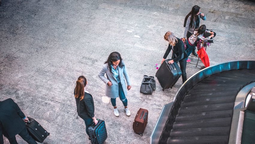 People collecting their luggage at an airport