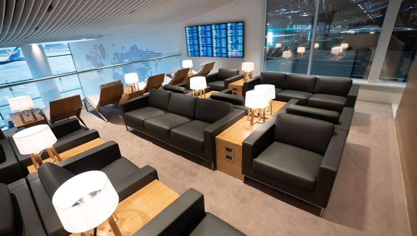 Airport lounge with large plush chairs and lights
