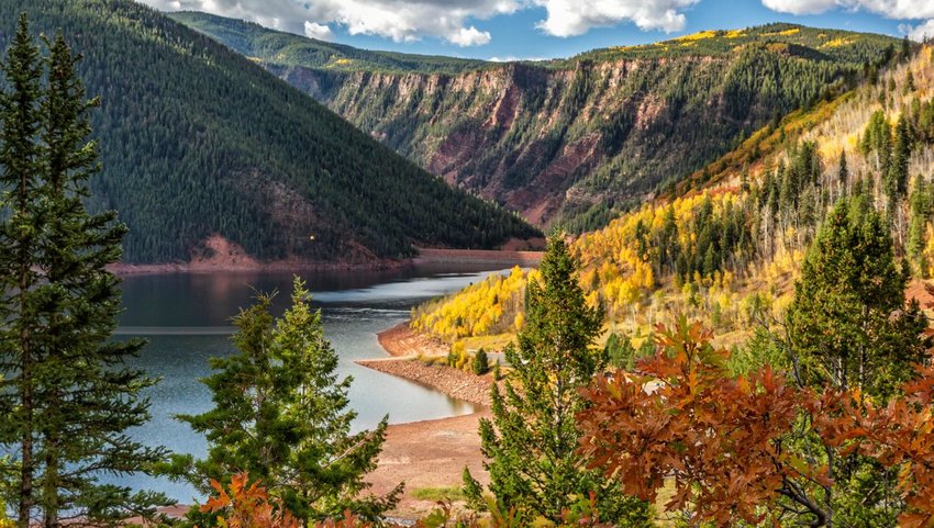 Fryingpan river running through mountains with fall colored trees