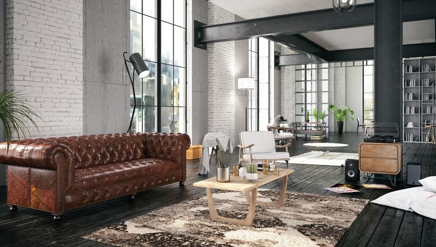 Interior of loft with leather couch and wood furniture