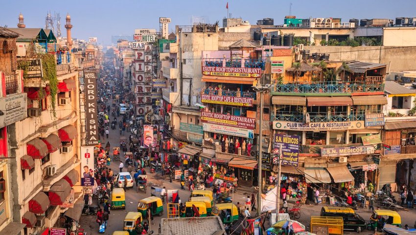 Crowded intersection with shops and restaurants