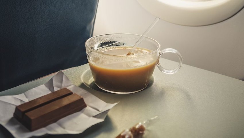 Coffee and chocolate on airplane tray 
