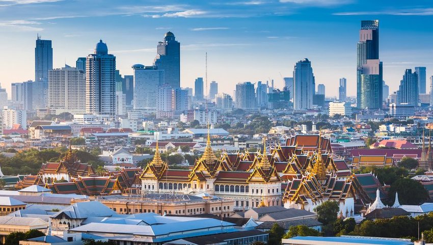 The Golden Grand Palace of Bangkok with skyscrapers in the background 