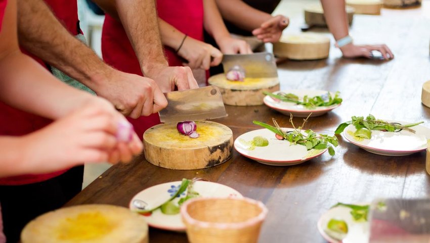 People learning to cook traditional thai food