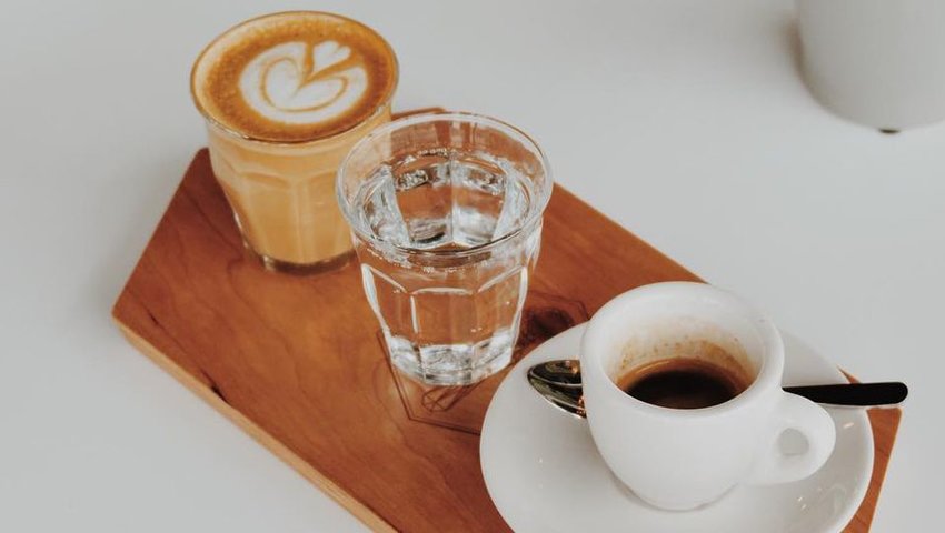 Coffee sitting on a wooden platter