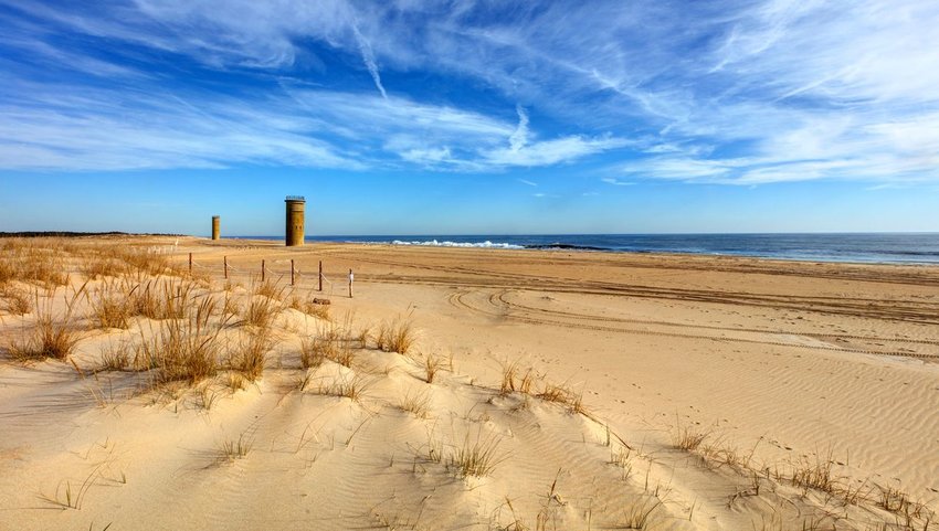 Old towers standing on the beach taken from the dunes