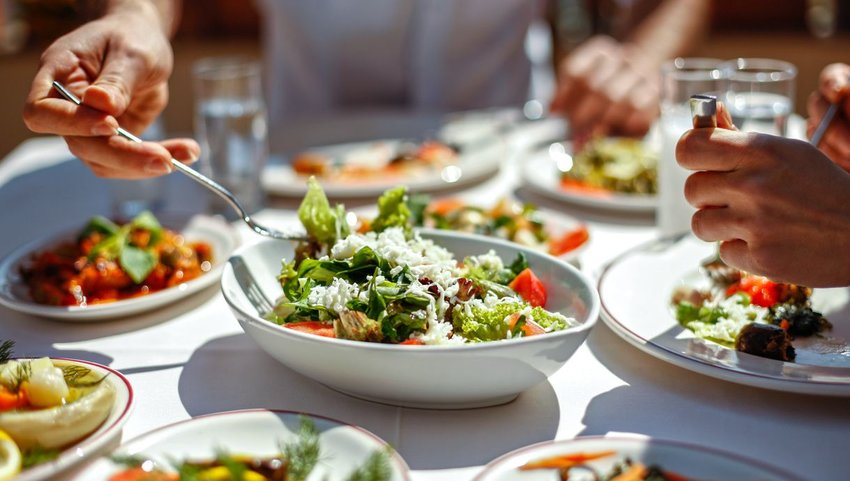 People sharing plates of food