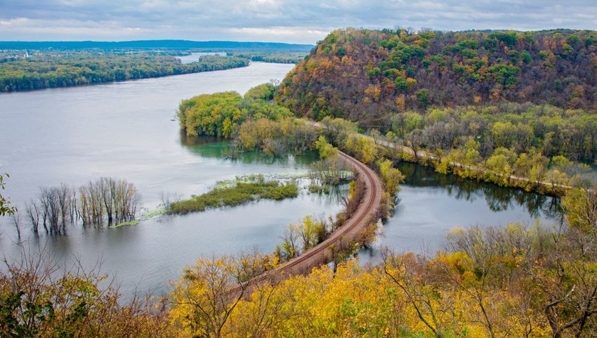 Above Mississippi river and woodlands during autumn at Iowa border