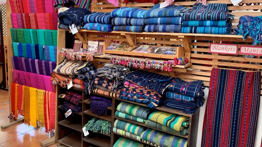 Blankets and scarves for sale in Guatemala | Photo by Fiona Mokry