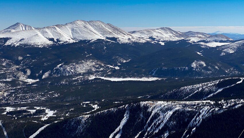 An aerial view of Breckenridge's Five Peaks with snowy caps.