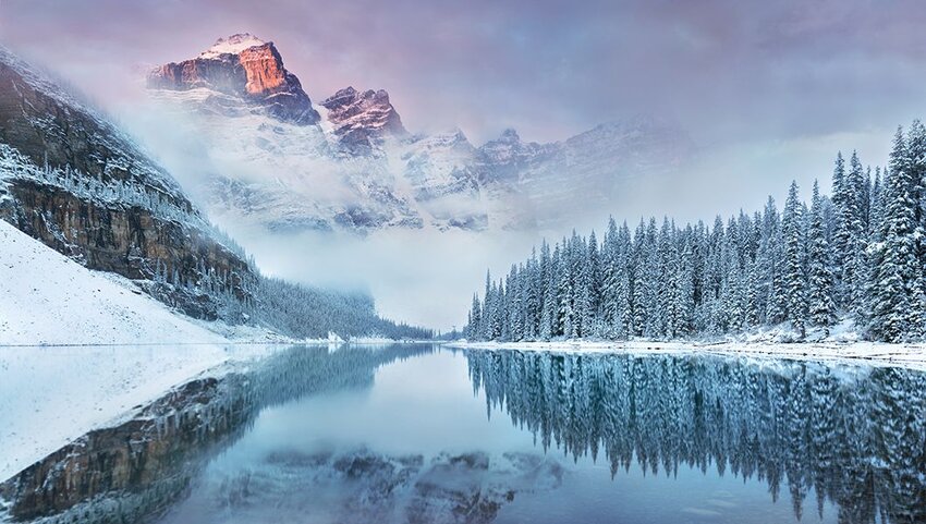 Snow and Moraine Lake in Banff National Park Alberta.