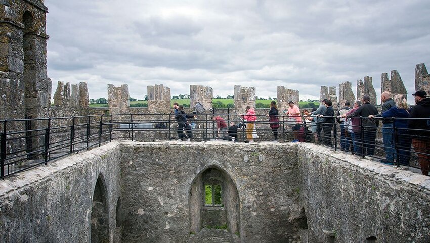 Queue of people to kiss the legendary Blarney Stone at the roof of Blarney Castle.