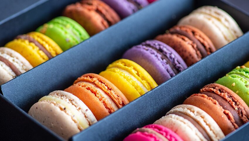 Box of colorful French macaroons.