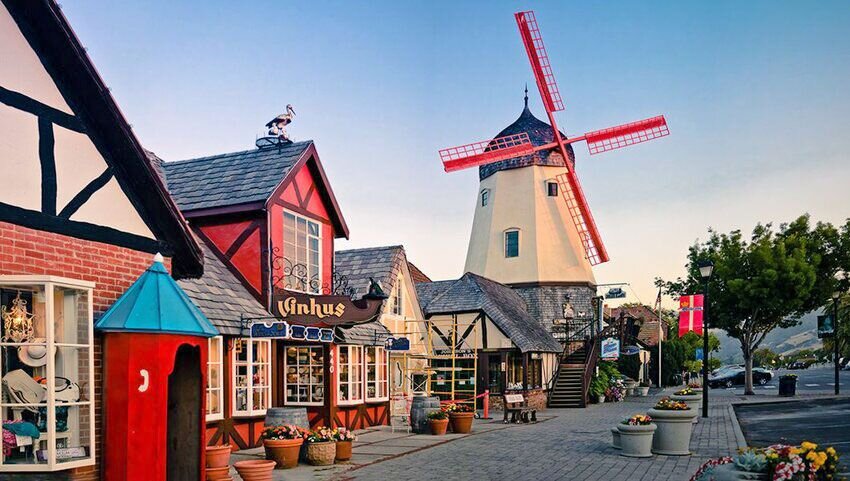 Street in Solvang lined with Danish style shops and windmill.