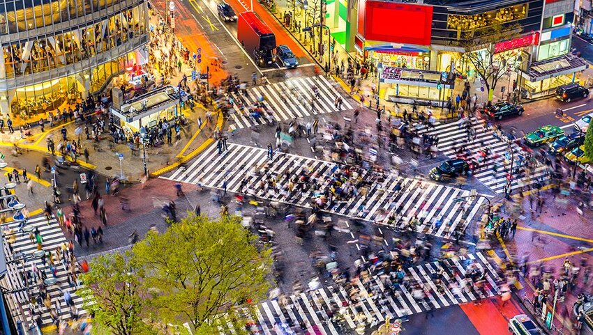 View of people walking at Shibuya Crossing in Tokyo.