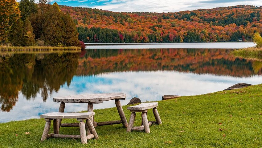 Rustic wooden table and chairs by Silver Lake in Barnard, Vermont. 