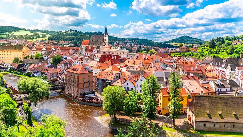 Panoramic view of Cesky Krumlov with St Vitus church in the middle of historical city centre.