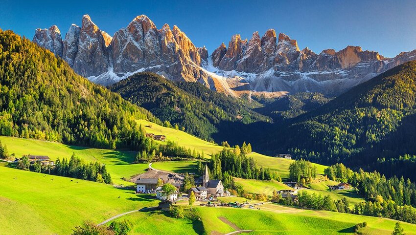 Santa Maddalena village with Dolomites mountains in background.