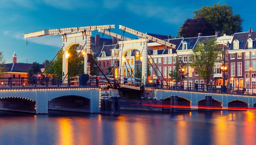 Magere Brug with night lighting over the river Amstel inAmsterdam, Holland, Netherlands.