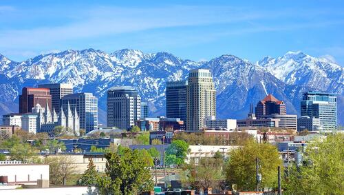 Salt Lake City downtown skyline with mountains in distance.