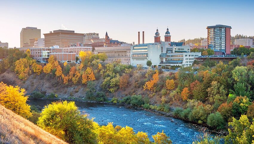 Downtown Spokane, Washington skyline and the Spokane River at sunrise.