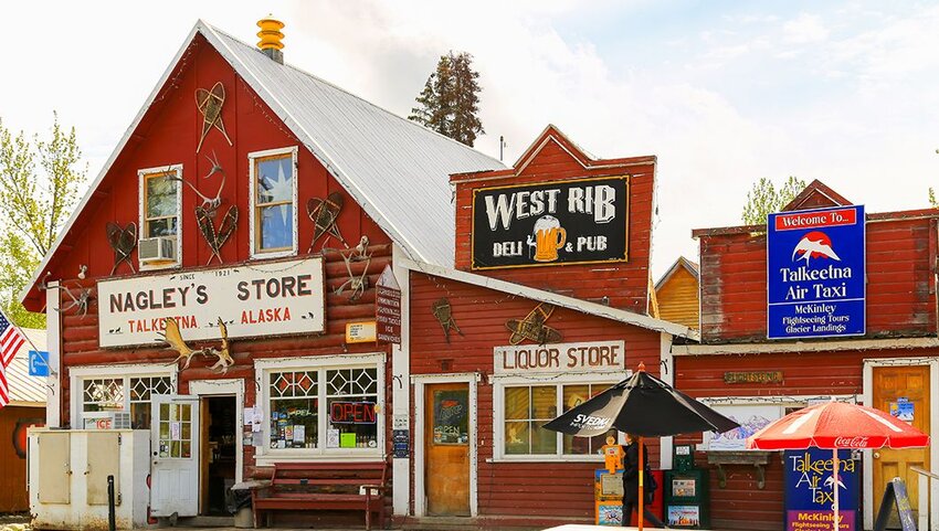 Facade of stores and pubs in the small oldtown of Talkeetna, Alaska.