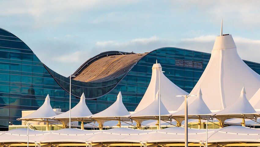 Roof top view of the Denver Airport on a semi sunny day.